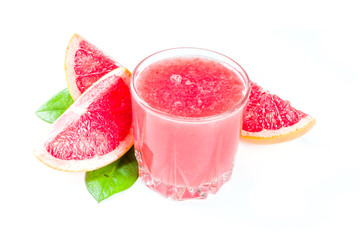 Glass of grapefruit juice with whole and sliced grapefruit isolated on white background