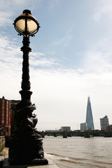 Silhouetted Lantern and Cityscape