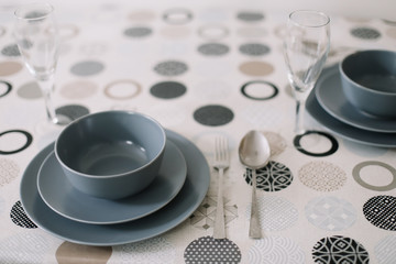 table setting. Tableware and decorations for serving a festive table. Plates, wine glasses and cutlery. kitchen interior design. 