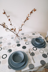 table setting. Tableware and decorations for serving a festive table. Plates, wine glasses and cutlery. kitchen interior design. 