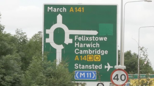 M11 road sign with cars going past