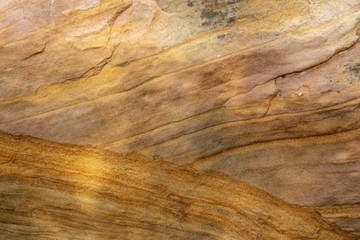 Time and water leave their marks on the surface of the sandstone rock faces of Capitol Reef National Park, Utah