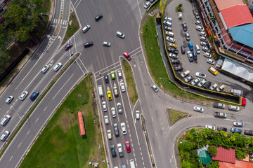 Aerial Drone image of car moving on surrounding Residential area at Kota Kinabalu, Sabah, Malaysia