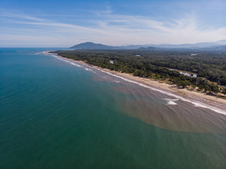 Beautiful Tropical beach with sea and palm taken from drone