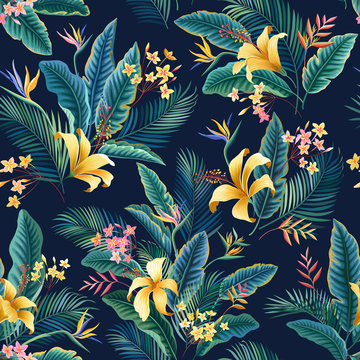 seamless floral pattern. tropical floral tropical pattern with hibiscus and palm tree leaves on dark blue