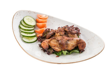 Chicken tobacco with fresh tomato and cucumber on white plate isolated on white background