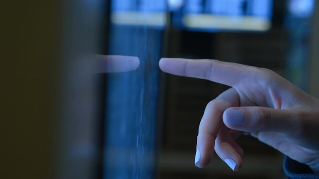 girl hand orders at fast food cafe using touch screen close