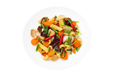 Closeup plate of traditional thai food - stir fried chicken with cashew nuts isolated at white background.
