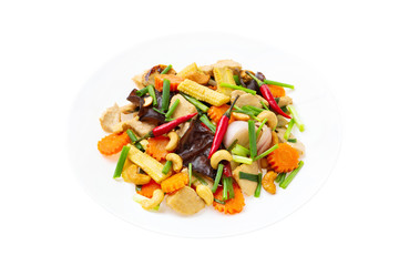 Closeup plate of traditional thai food - stir fried chicken with cashew nuts isolated at white background.