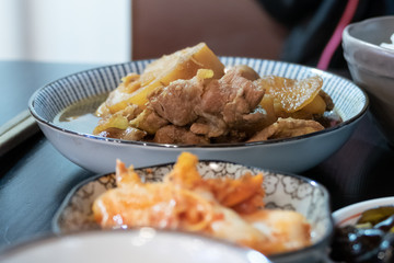 Chinese pork dish on table with side dishes