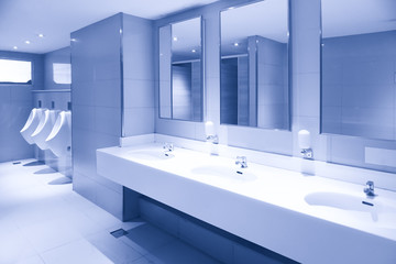Men's room urinals discharge ,Toilet bowl in a modern bathroom ,Toilet sink interior of public...