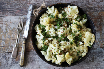 Baked cauliflower with spices and olive oil. Vegan diet. Healthy food. Selective focus. Macro.