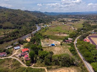 Beautiful Aerial image of rural landscape with beautiful young green paddy field in Tambunan, Sabah, Borneo