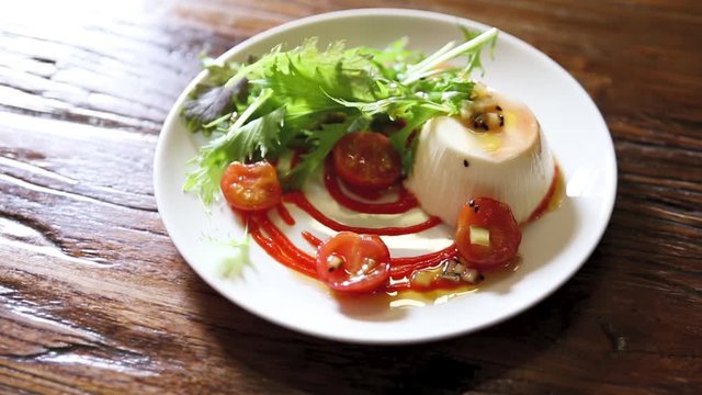 Tomato mozzarella prepared on a plate