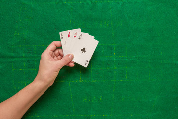 Gambling flat lay.Close-up cards for playing poker on a gaming table in a casino against a background of chips. Background for a gaming business