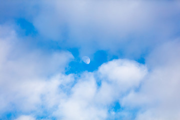 blue sky with clouds and Moon