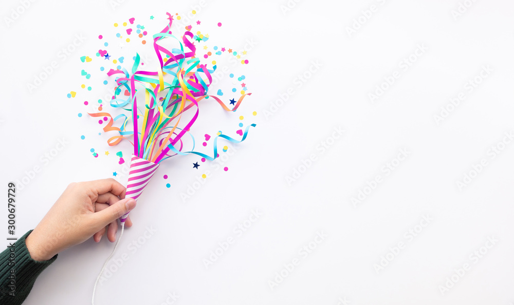 Wall mural celebration party and anniversary concepts ideas with woman hand holding colorful confetti,paper art