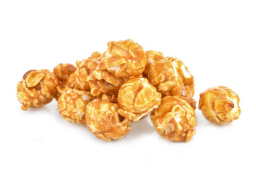 pieces of caramel popcorn on a white background