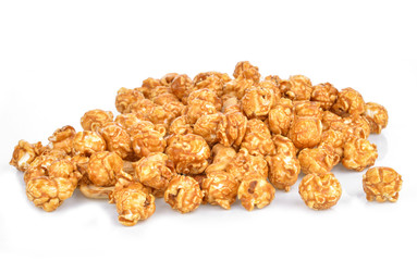 pieces of caramel popcorn on a white background