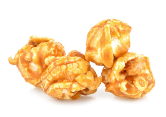 pieces of caramel popcorn on a white background