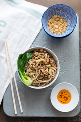 Chinese Udon Noodles with Minced Pork in Spicy Sauce Served with Pak Choi