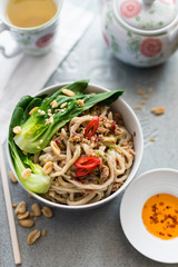 Chinese Udon Noodles with Minced Pork in Spicy Sauce Served with Pak Choi