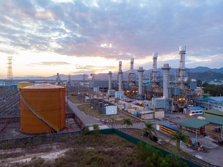 Aerial image of Electricity transmission sub-station and power plant during sunrise at Sabah, Borneo