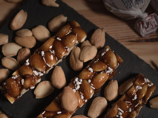Turron bar of caramelised sugar and almonds. Traditional spanish Christmas sweets
