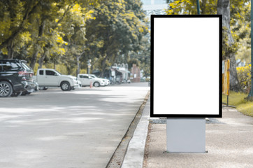 led blank billboard white screen side road in city. ad mockup copy space for advertising banner near bus stop in metropolis.