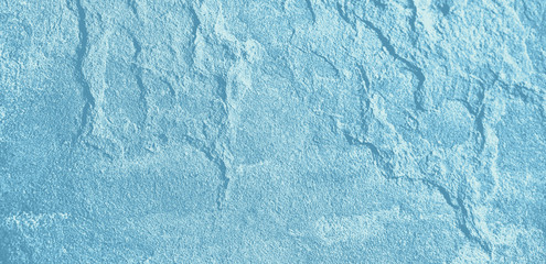 surface of an old wall with cement plaster grunge background texture blue