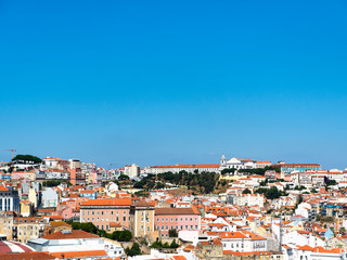 Fototapeta premium View from the Miradouro de Sao Pedro de Alcantara in the upper town of Bairro Alto, Lisbon, Portugal