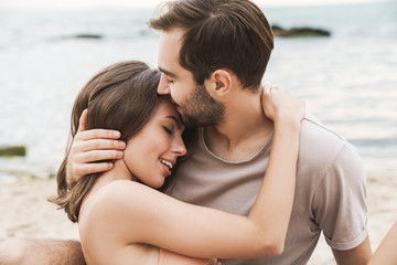 Fototapeta premium Photo of romantic young couple hugging and smiling