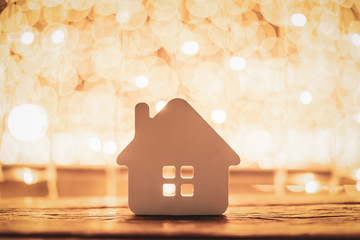 House model on wood table. Real estate agent offer house, property insurance and security, affordable housing concepts