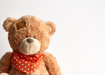 brown vintage teddy bear with patches