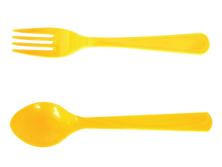 Yellow spoon and fork isolated on white background