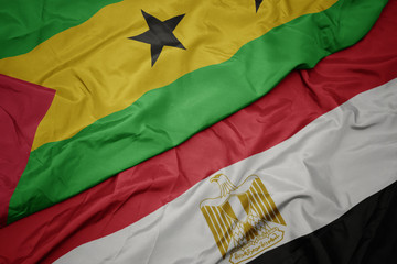 waving colorful flag of egypt and national flag of sao tome and principe .