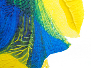 The blue, green and yellow acrylic painting with color texture on white paper background by using...