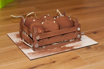 Brown chokolate sweet potato cake on a wooden dark background. Fudge nuggets with cream photo