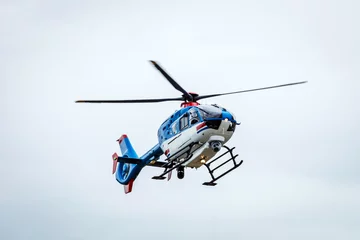 Foto op Plexiglas Police helicopter in air. The eye in the sky concept. © Jon Anders Wiken