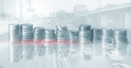 Double exposure of city and coins for finance and business concept.
