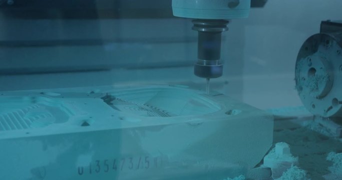 CNC milling tool machinery makes precision cuts in industrial component casting material
