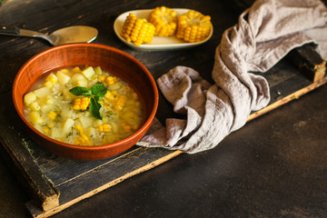 soup with corn and vegetables (first course, vegetarian dish) menu concept. food background. copy space. Top view
