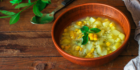 soup with corn and vegetables (first course, vegetarian dish) menu concept. food background. copy space. Top view