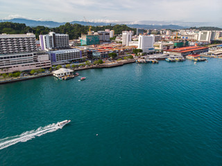 Fototapeta na wymiar Kota Kinabalu cityscape aerial photo with fisherman boat parking at Waterfront Kota Kinabalu. Kota Kinabalu is the capital of Malaysia’s Sabah state.