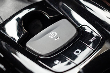 electronic handbrake button in luxury modern car