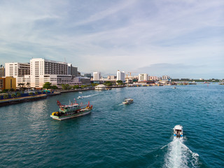 Kota Kinabalu cityscape aerial  photo with fisherman boat parking at Waterfront Kota Kinabalu. Kota Kinabalu is the capital of Malaysia’s Sabah state.