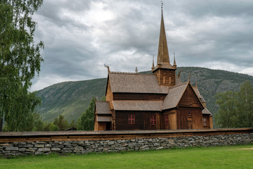 Fototapeta na wymiar Lom stave church in Norway. Old ancient viking church. Vikings, religion, wooden church, wooden, cemetary, building concept.