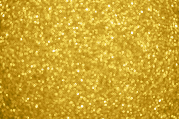 Abstract blur gold glitter sparkle defocused bokeh light background