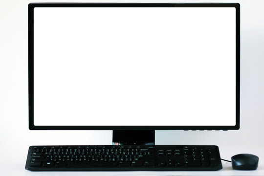 Soft focus and blur.Blank white computer screen on white table