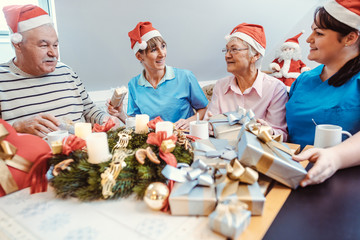 Christmas with presents in the nursing home with seniors
